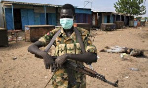 MDG : a rebel fighter stands in front of Kali-Ballee mosque, Bentiu, South Sudan