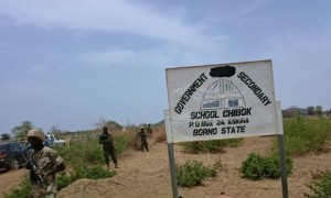 Soldiers stand guard in front of the school in Chibok, Nigeria