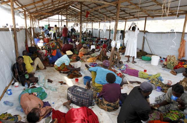 A general view shows Burundian refugees receiving treatment at a makeshift clinic at the Lake Tanganyika stadium in Kigoma western Tanzania