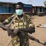 MDG : a rebel fighter stands in front of Kali-Ballee mosque, Bentiu, South Sudan