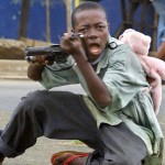 (FILES) A child soldier wearing a teddy