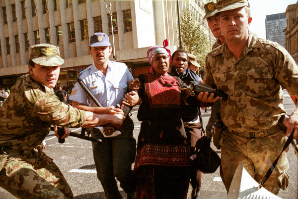 Johannesburg, Sputh Africa 1990-1993: Winnie Mandela, the wife of African National Congress leader Nelson Mandela is arrested by police in downtown Johannesburg during a protest. Photo / Joao Silva.