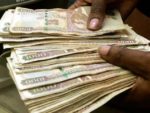 a, Kenyan-clutching-on-multiple-one-thousand-shilling-notes_-A-Commercial-Bank-of-Africa-report-has-revealed-thet-the-Kenyan-Shilling-has-outperformed-other-East-African-currencies