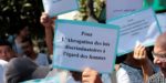 Moroccan activists hold signs in solidarity with Hajar Raissouni, a journalist charged with fornication and abortion, during a protest outside the Rabat tribunal,